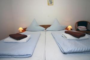 Postel nebo postele na pokoji v ubytování Apartmani Amado/Lozic