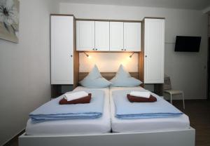 Postel nebo postele na pokoji v ubytování Apartmani Amado/Lozic