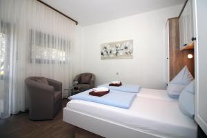 Postel nebo postele na pokoji v ubytování Apartmani Amado/Lozic