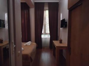 TV a/nebo společenská místnost v ubytování La'Rooms