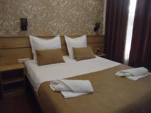 Postel nebo postele na pokoji v ubytování La'Rooms