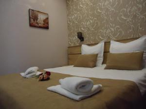 Postel nebo postele na pokoji v ubytování La'Rooms