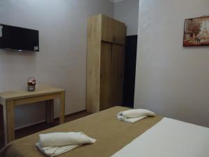 Postel nebo postele na pokoji v ubytování La'Rooms