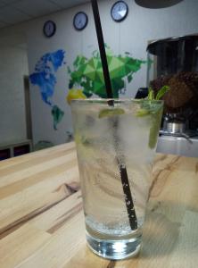 a glass of water with a stick in it on a table at Hostel Svit Hub in Kamianets-Podilskyi +31 photos