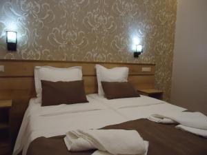 Postel nebo postele na pokoji v ubytování La'Rooms
