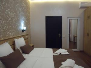 Postel nebo postele na pokoji v ubytování La'Rooms