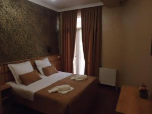Postel nebo postele na pokoji v ubytování La'Rooms