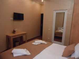 Postel nebo postele na pokoji v ubytování La'Rooms