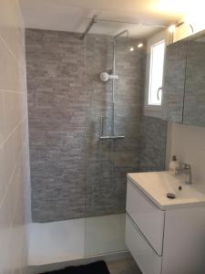 a bathroom with a shower and a sink at Appartement cap d'agde in Cap d'Agde +7 photos