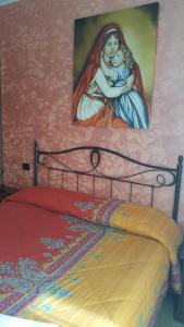 A bed or beds in a room at B&B Cuoreverde Pollino