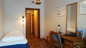 Postel nebo postele na pokoji v ubytování Bardu Hotell