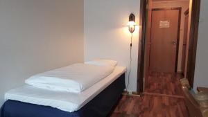 Postel nebo postele na pokoji v ubytování Bardu Hotell