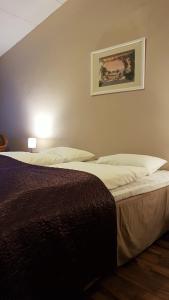 Postel nebo postele na pokoji v ubytování Bardu Hotell