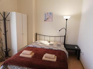 A bed or beds in a room at Sfiggos 54 Guest House