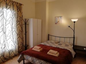 A bed or beds in a room at Sfiggos 54 Guest House