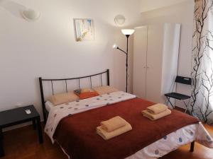 A bed or beds in a room at Sfiggos 54 Guest House