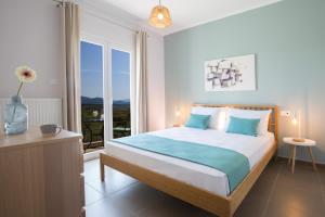 Postel nebo postele na pokoji v ubytování Alegria Boutique Villas