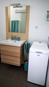 a bathroom with a sink and a mirror at THE BLUE VIEW MASPALOMAS in San Agustin