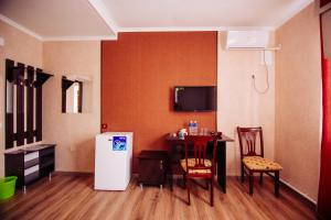 TV in/ali zabaviščno središče v nastanitvi Asman Guest House
