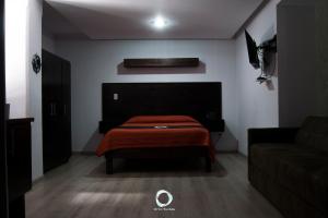 Postel nebo postele na pokoji v ubytování Hotel Onix Suites