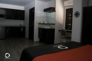 Postel nebo postele na pokoji v ubytování Hotel Onix Suites