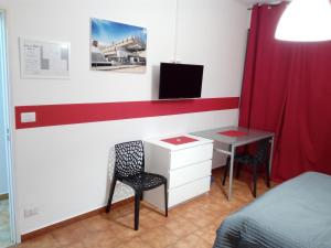 TV a/nebo společenská místnost v ubytování Ivrea la Bella