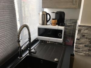 a microwave sitting on top of a kitchen counter at Catalans in Marseille