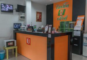 an orange and black counter in a store at Noble U-house Chiangmai in Chiang Mai