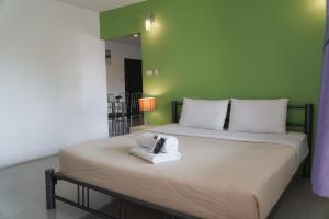 Postel nebo postele na pokoji v ubytování Noble House Chiangmai