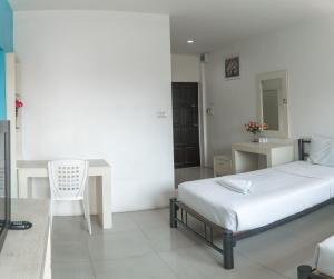 Postel nebo postele na pokoji v ubytování Noble House Chiangmai