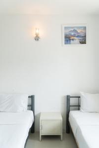 Postel nebo postele na pokoji v ubytování Noble House Chiangmai