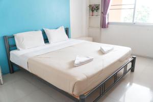 Postel nebo postele na pokoji v ubytování Noble House Chiangmai