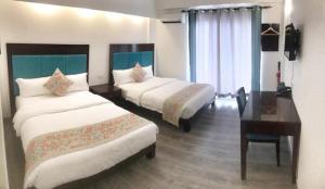 Postel nebo postele na pokoji v ubytování El Puerto Boracay