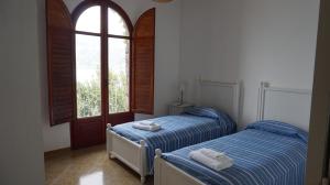 Säng eller sängar i ett rum på Villa Malù Amalfi Coast