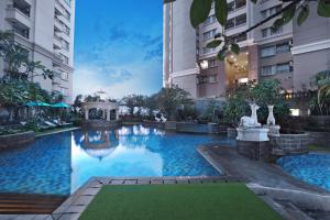 a swimming pool in the middle of a building at Grand Dafam Ancol Jakarta in Jakarta