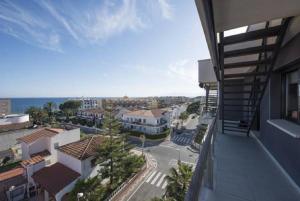 a view of a city from a balcony of a building at Tropicana Planet Costa Dorada in Cambrils