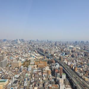 a city with many buildings and a train on the tracks at Art Hotel Osaka Bay Tower in Osaka