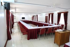 a large meeting room with a long table and chairs at Prestige Leisure Hotel in Mtwapa