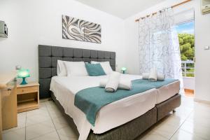 Postel nebo postele na pokoji v ubytování Platoni Elite Villas