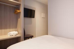 Postel nebo postele na pokoji v ubytování Hostal Centric