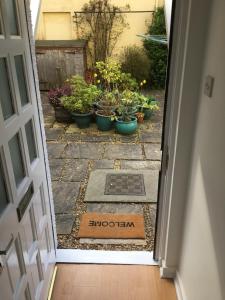 an open door with a sign that says brooklyn written on the ground at Beachside - North Berwick in North Berwick