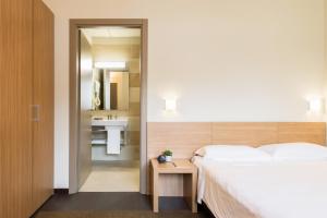 A bed or beds in a room at Residence Osoppo