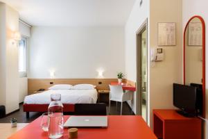 A bed or beds in a room at Residence Osoppo