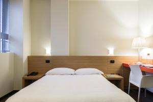 A bed or beds in a room at Residence Osoppo