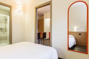 A bed or beds in a room at Residence Osoppo