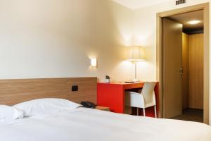 A bed or beds in a room at Residence Osoppo