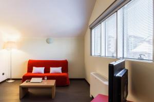 A seating area at Residence Osoppo