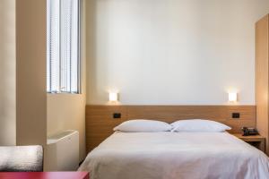 A bed or beds in a room at Residence Osoppo
