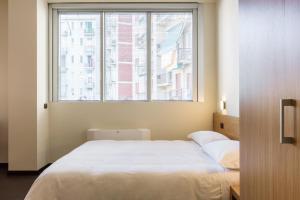 A bed or beds in a room at Residence Osoppo