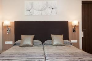 Postel nebo postele na pokoji v ubytování Hostal Centric